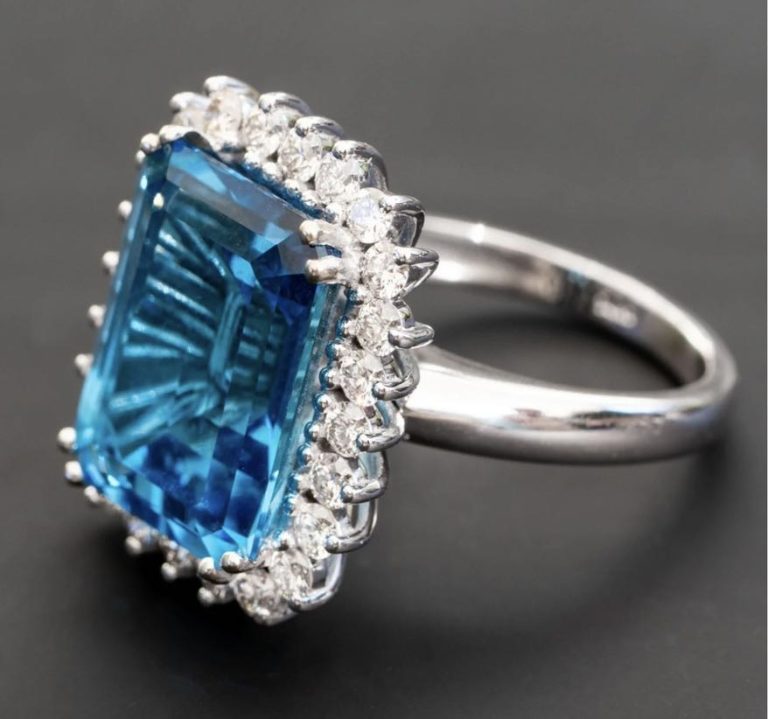 13.00 carat natural Swiss blue topaz ring with 1.20cts of natural Diamonds.