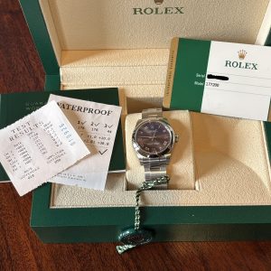 Rolex Oyster Perpetual.  31mm Red Grape Roman Numeral Dial.